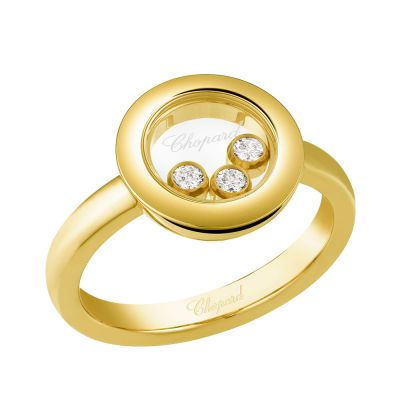 Sortija de oro amarillo con circulo y tres diamantes móviles entre dos cristales de zafiro.