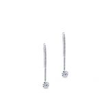 Pendientes largos de oro blanco con hilera de diamantes y diamante al aire